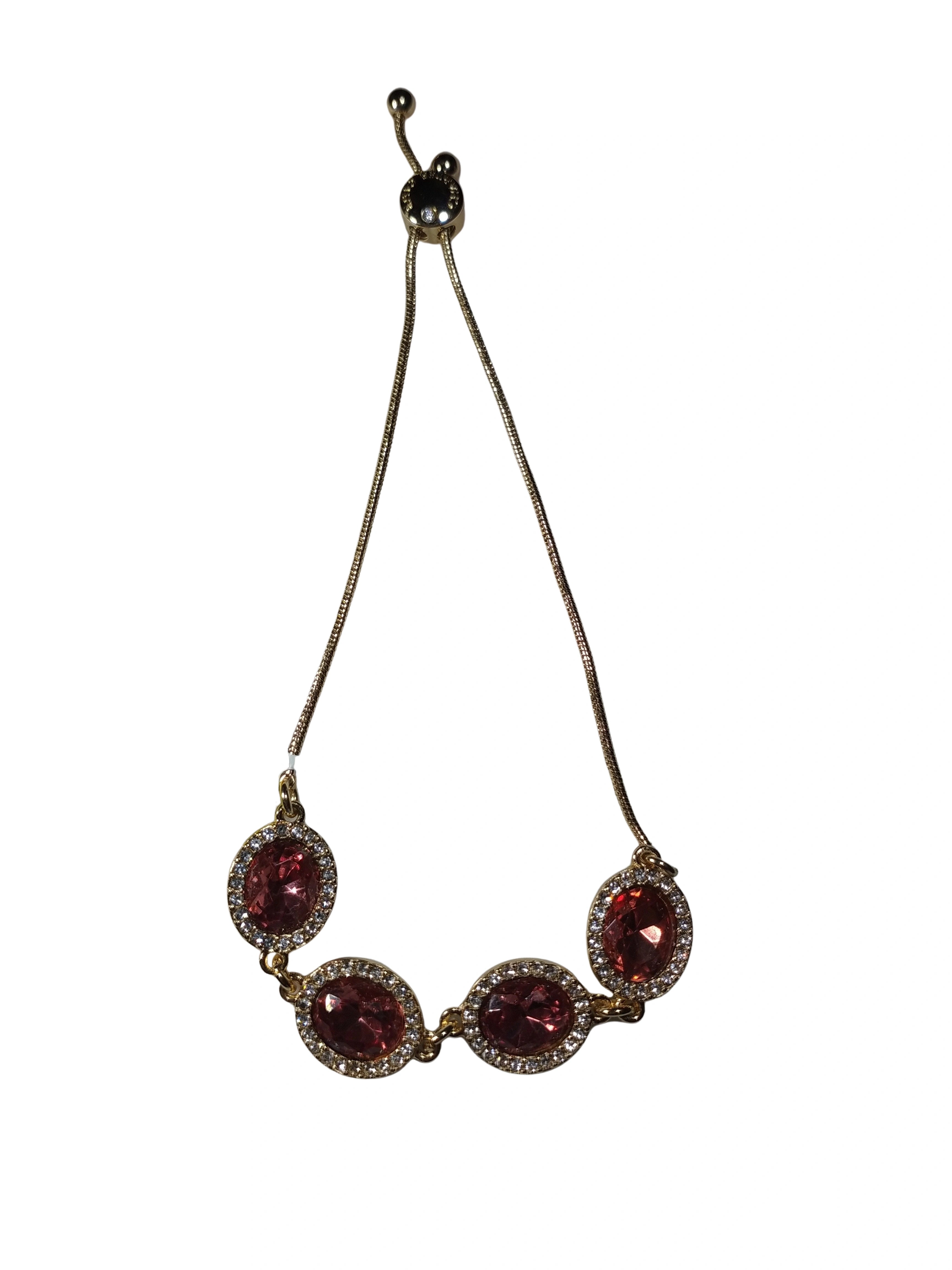 Necklace with red gemstones on a white background